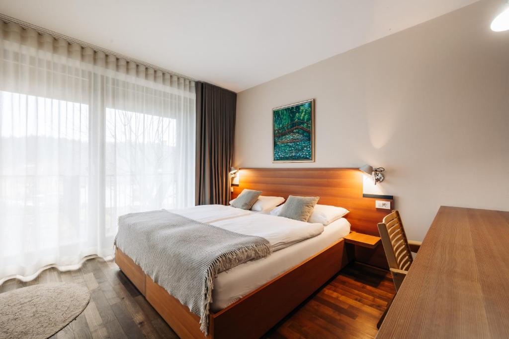 Postel nebo postele na pokoji v ubytování Hotel Rakar