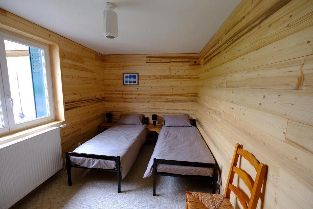 Postel nebo postele na pokoji v ubytování Gite des Rosiers