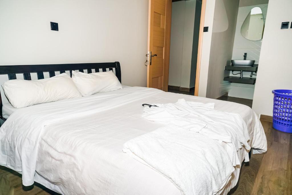 Postel nebo postele na pokoji v ubytování Runda Serene Accomodation
