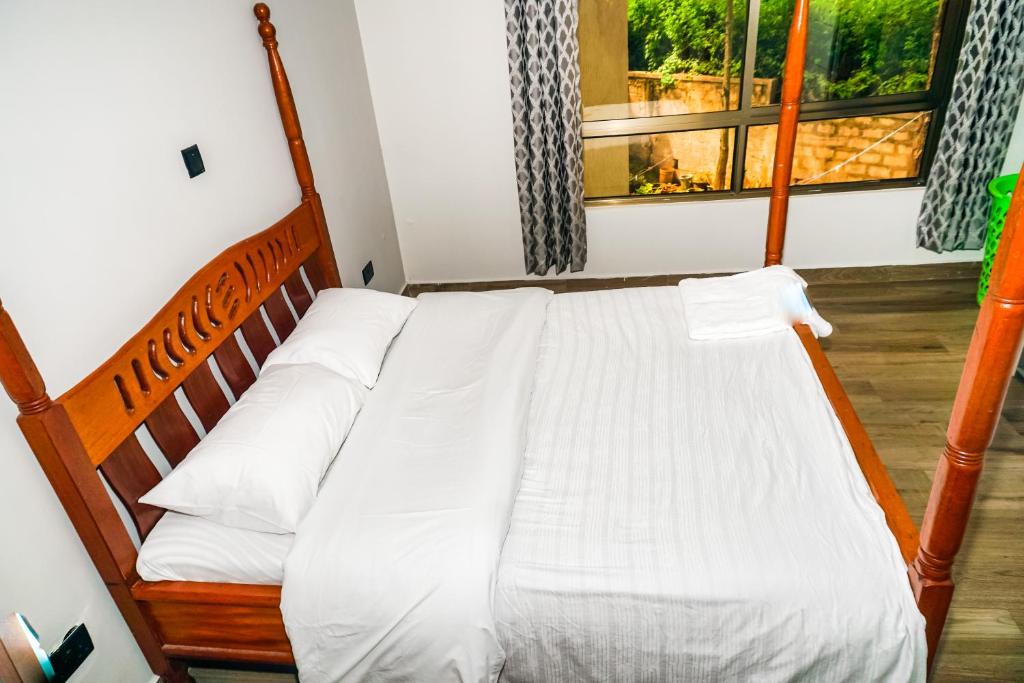 Postel nebo postele na pokoji v ubytování Runda Serene Accomodation
