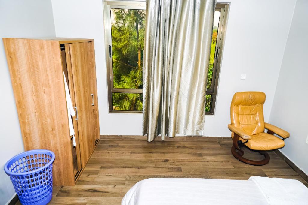 Postel nebo postele na pokoji v ubytování Runda Serene Accomodation