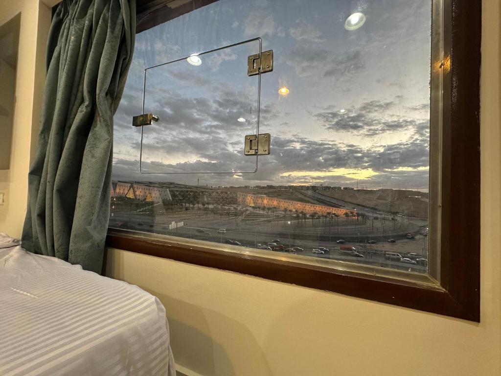 Postel nebo postele na pokoji v ubytování Grand Museum View Inn