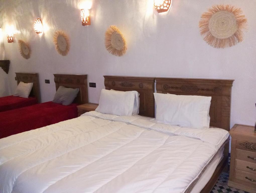 Postel nebo postele na pokoji v ubytování Riad Dar belghiti