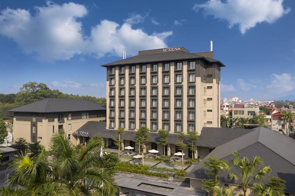 a large building with a lot of windows at Modena by Fraser Vinh Yen in Yen