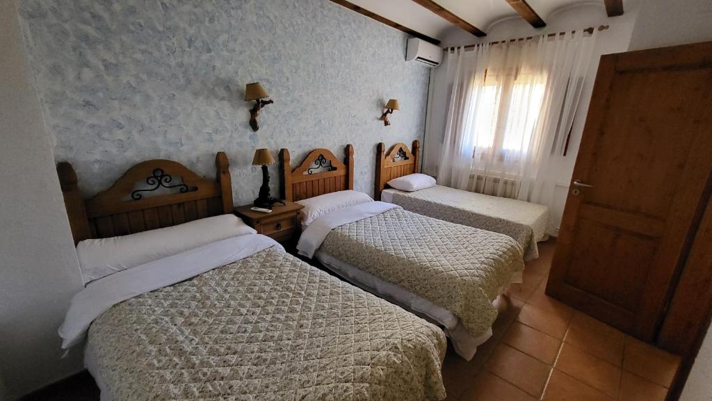 Posteľ alebo postele v izbe v ubytovaní El Mirador de Riópar Viejo