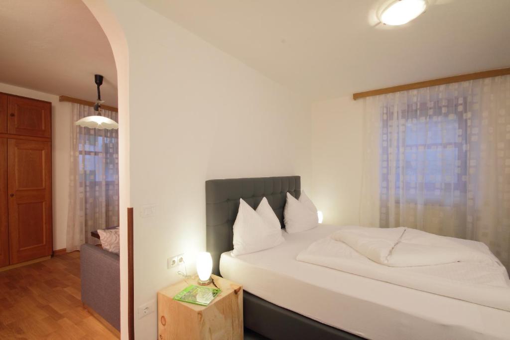 Postel nebo postele na pokoji v ubytování Pension & Residence Astoria