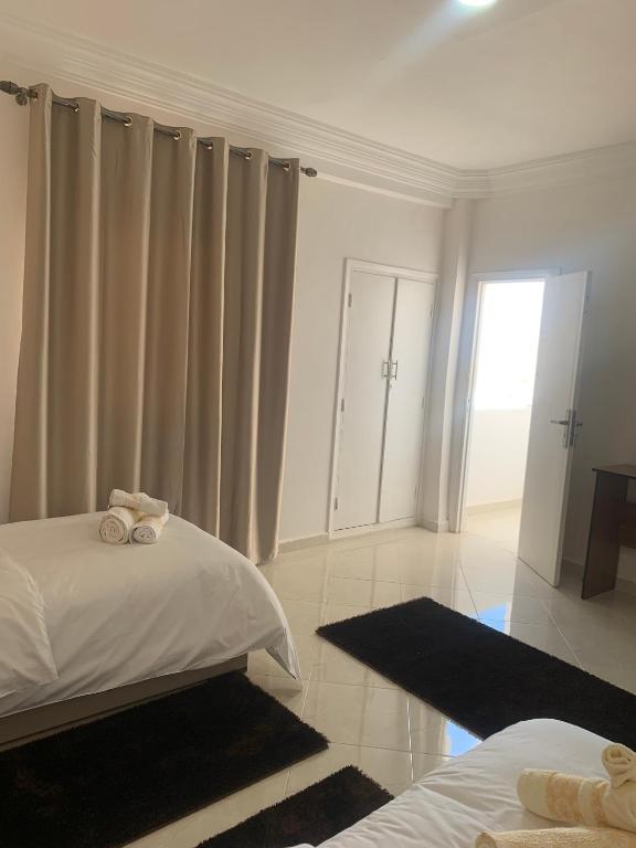 Postel nebo postele na pokoji v ubytování Hôtel Moukawama Restaurant & SPA Dakhla
