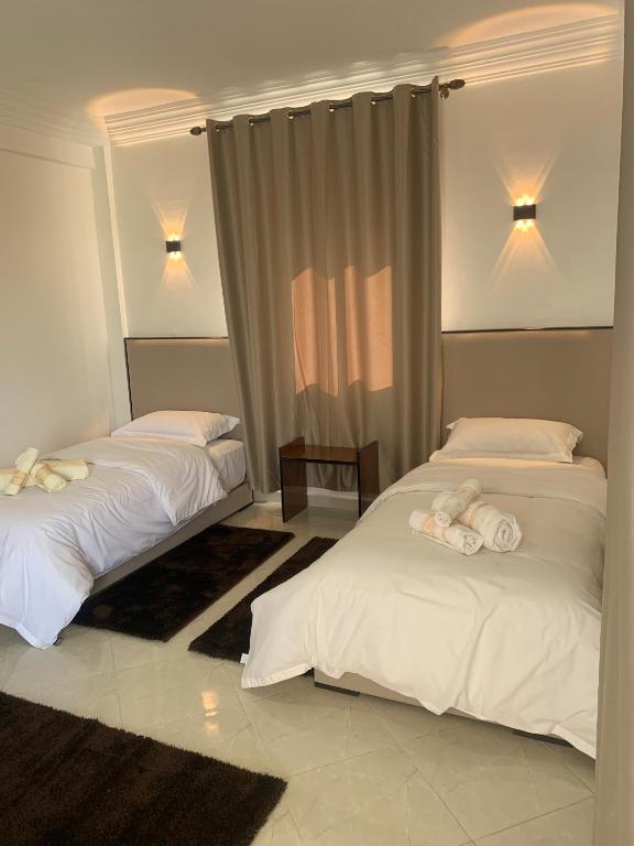 Postel nebo postele na pokoji v ubytování Hôtel Moukawama Restaurant & SPA Dakhla