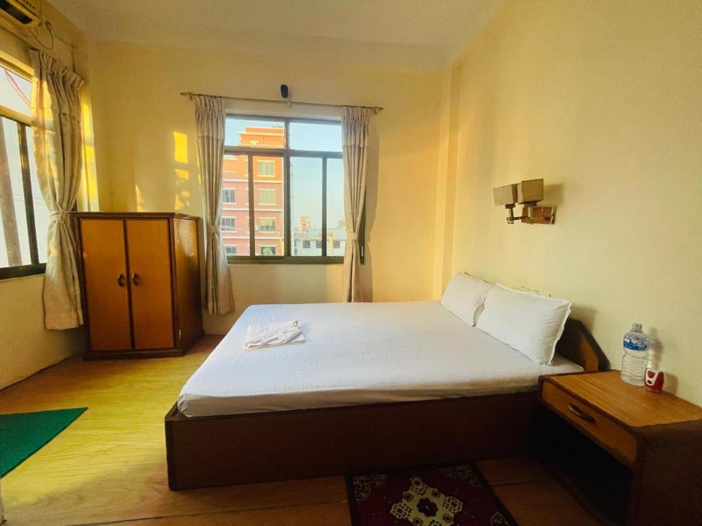 Postel nebo postele na pokoji v ubytování New Buddha Bhoomi Guest House