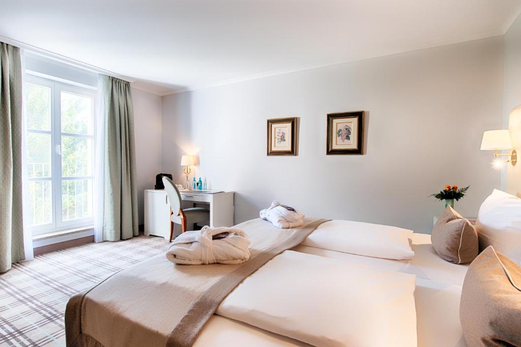 Postel nebo postele na pokoji v ubytování Hotel SchreiberHof