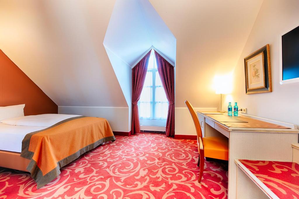 Postel nebo postele na pokoji v ubytování Hotel SchreiberHof