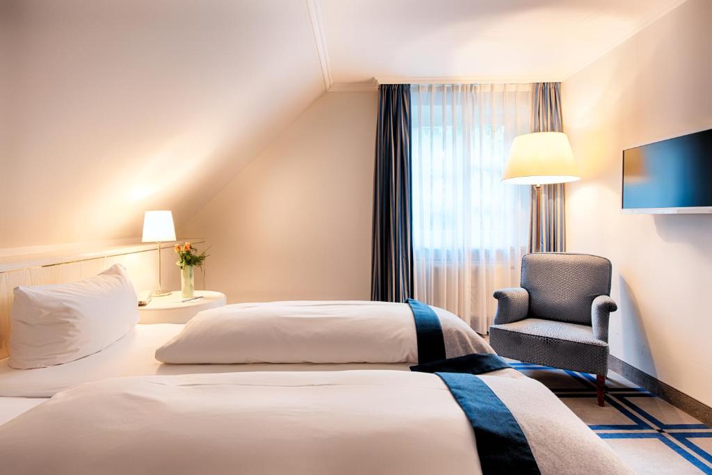 Postel nebo postele na pokoji v ubytování Hotel SchreiberHof