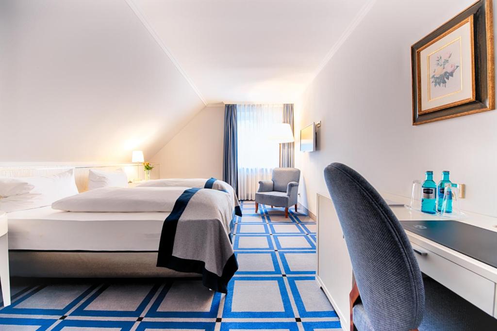 Postel nebo postele na pokoji v ubytování Hotel SchreiberHof
