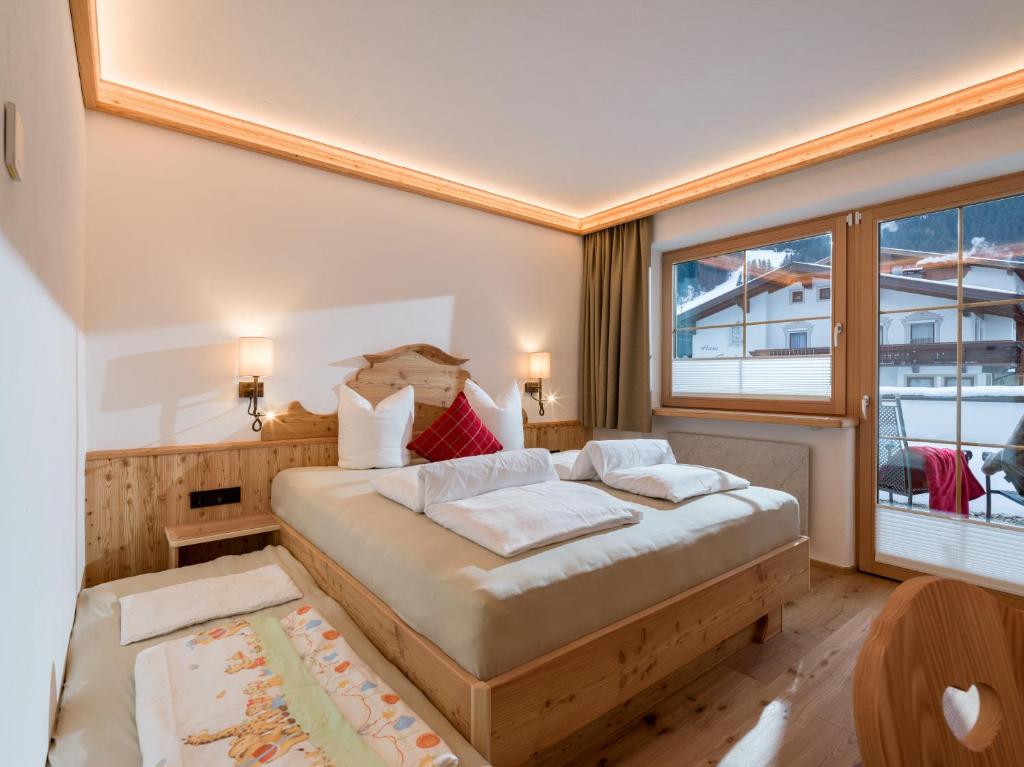 Postelja oz. postelje v sobi nastanitve Hotel Ritterhof Ellmau