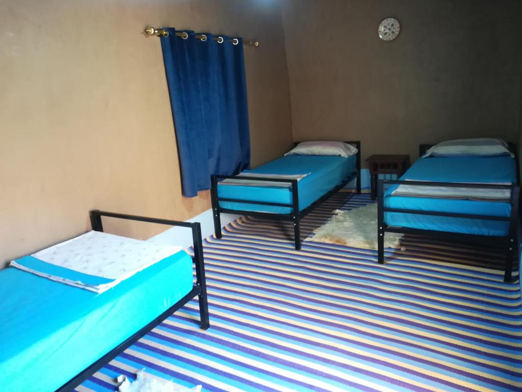 Postel nebo postele na pokoji v ubytování Gite Amoudou