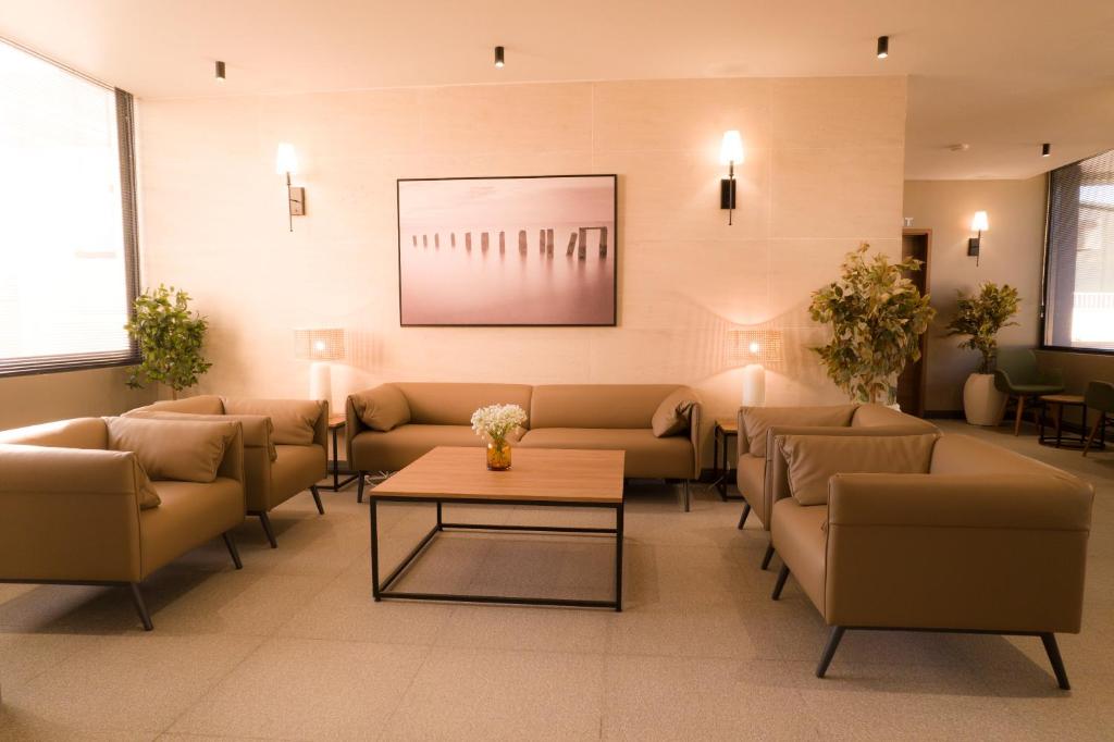 Posezení v ubytování New Amaan Hotel