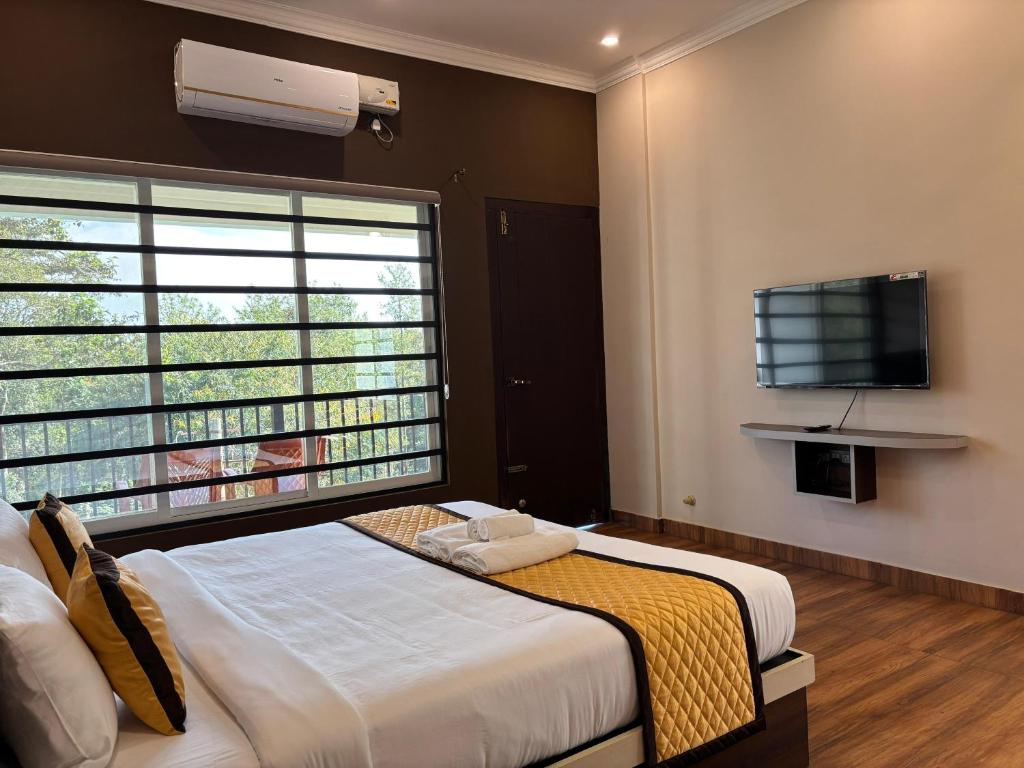 Postelja oz. postelje v sobi nastanitve Coorg Le Embera