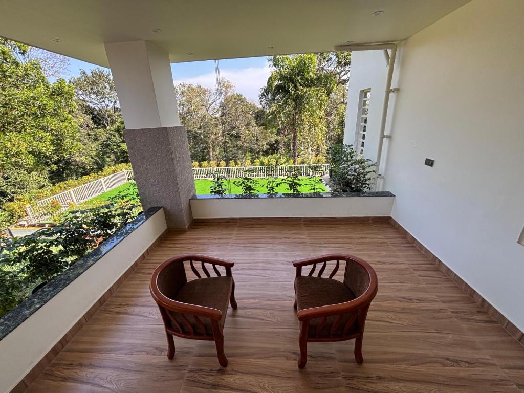 Balkon oz. terasa v nastanitvi Coorg Le Embera