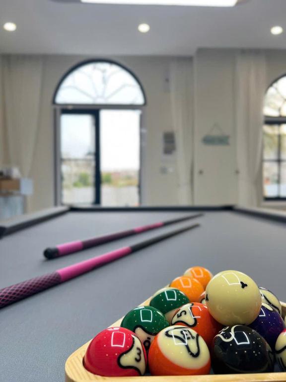 a pile of billiard balls on a pool table at KB Villas 51 in Bình Tú