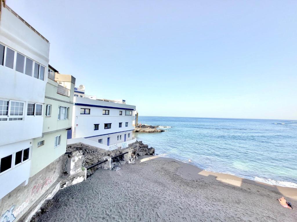 a view of the ocean from the side of a building at Gaviota in Puerto de la Cruz