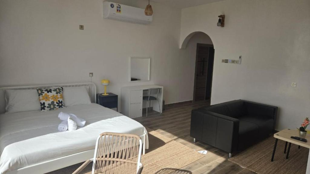 Postel nebo postele na pokoji v ubytování Roghan Hospitality Inn