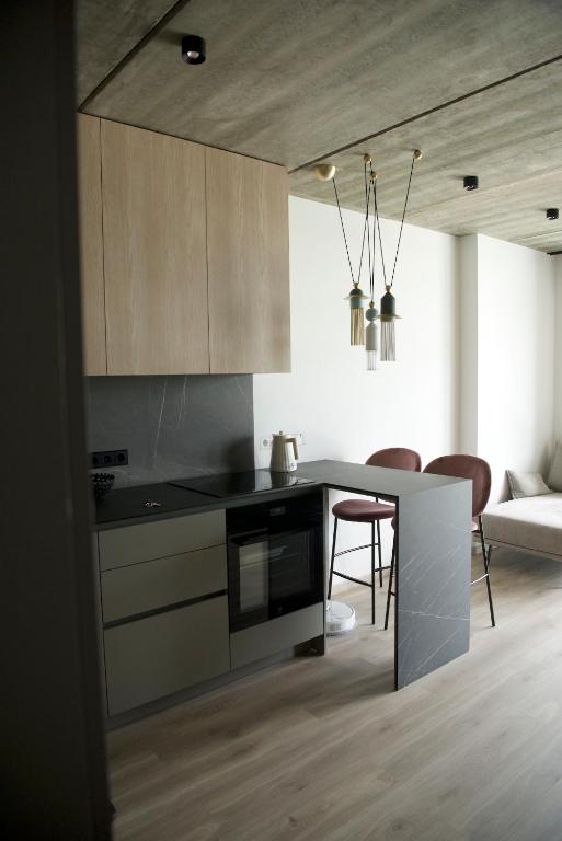 Η κουζίνα ή μικρή κουζίνα στο Ralio apartamentai monkey