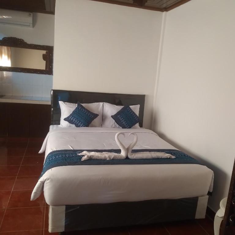 Postel nebo postele na pokoji v ubytování Inn Between