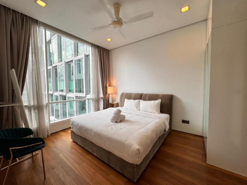 Postel nebo postele na pokoji v ubytování Soho Suites KLCC