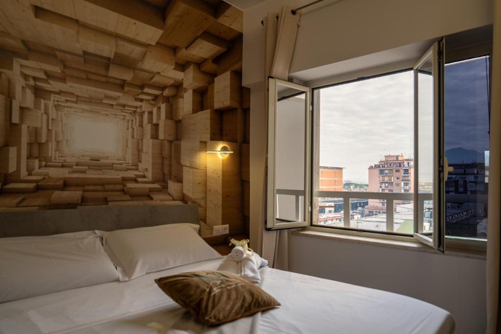 Postel nebo postele na pokoji v ubytování Napolitano Rooms - Central Station