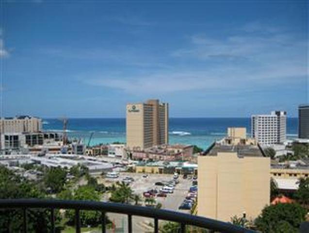 a view of a city with the ocean and buildings at Tumon Bay Capital Hotel in Tumon
