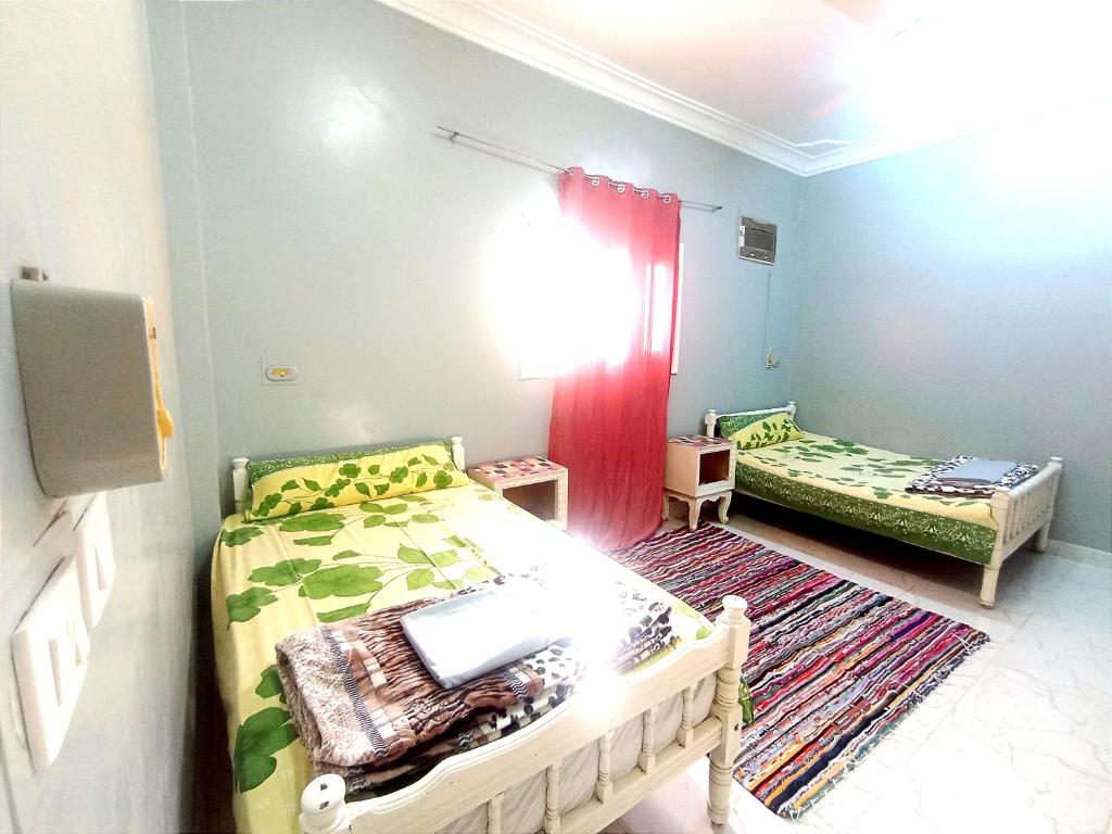 Postel nebo postele na pokoji v ubytování Winji Guest house