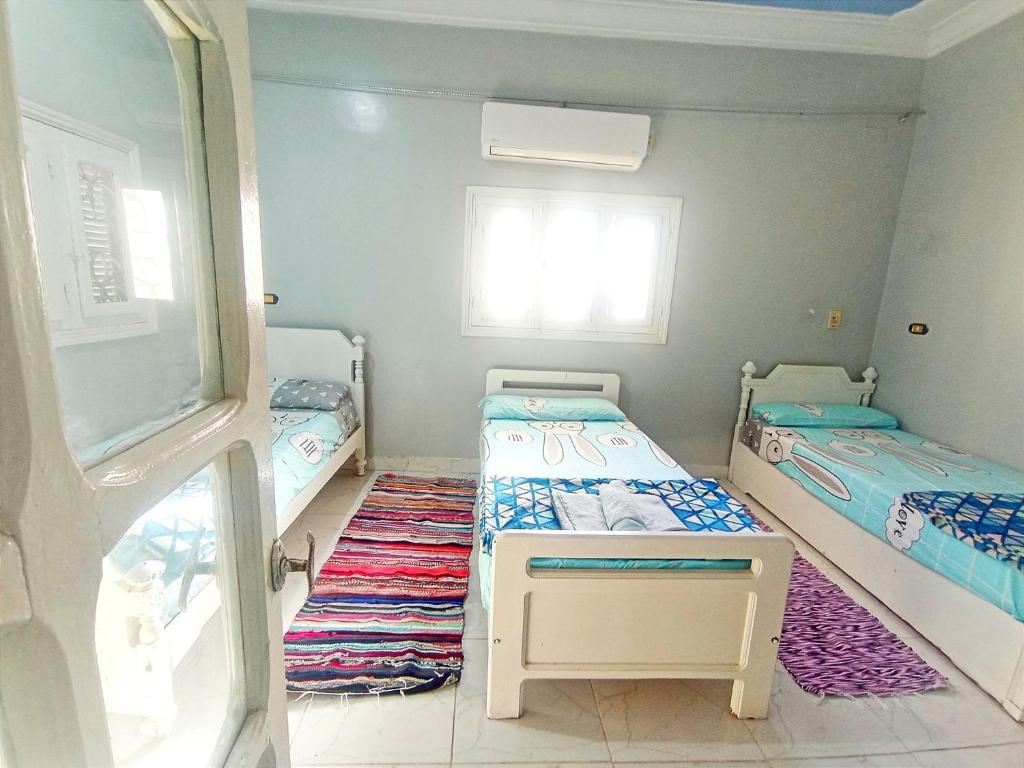 Postel nebo postele na pokoji v ubytování Winji Guest house