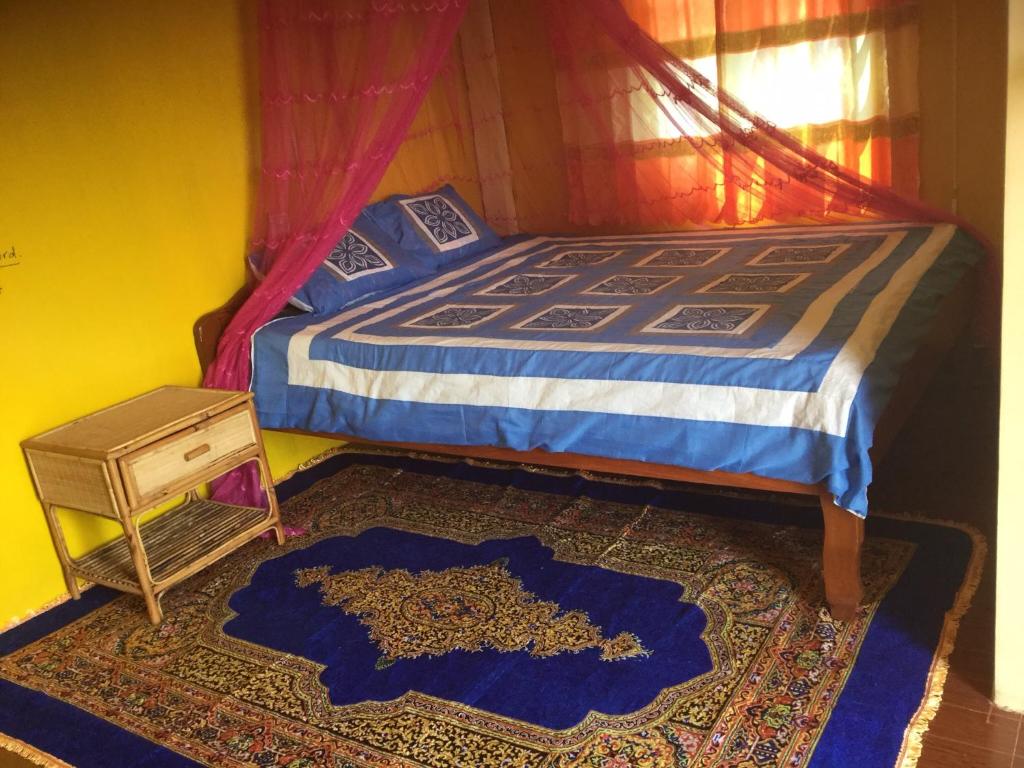 Postel nebo postele na pokoji v ubytování Bunyong Homestay