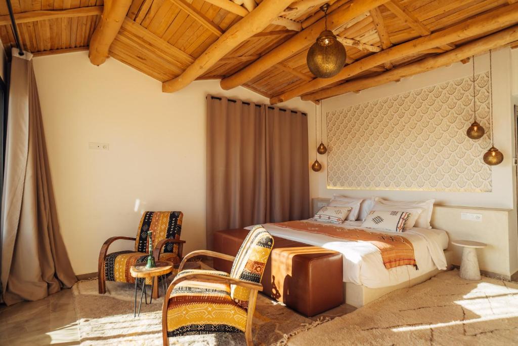 Postel nebo postele na pokoji v ubytování Sahara pearl Hotel