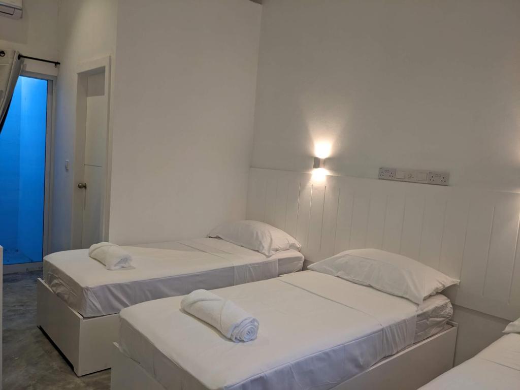 Postel nebo postele na pokoji v ubytování Avi Guesthouse