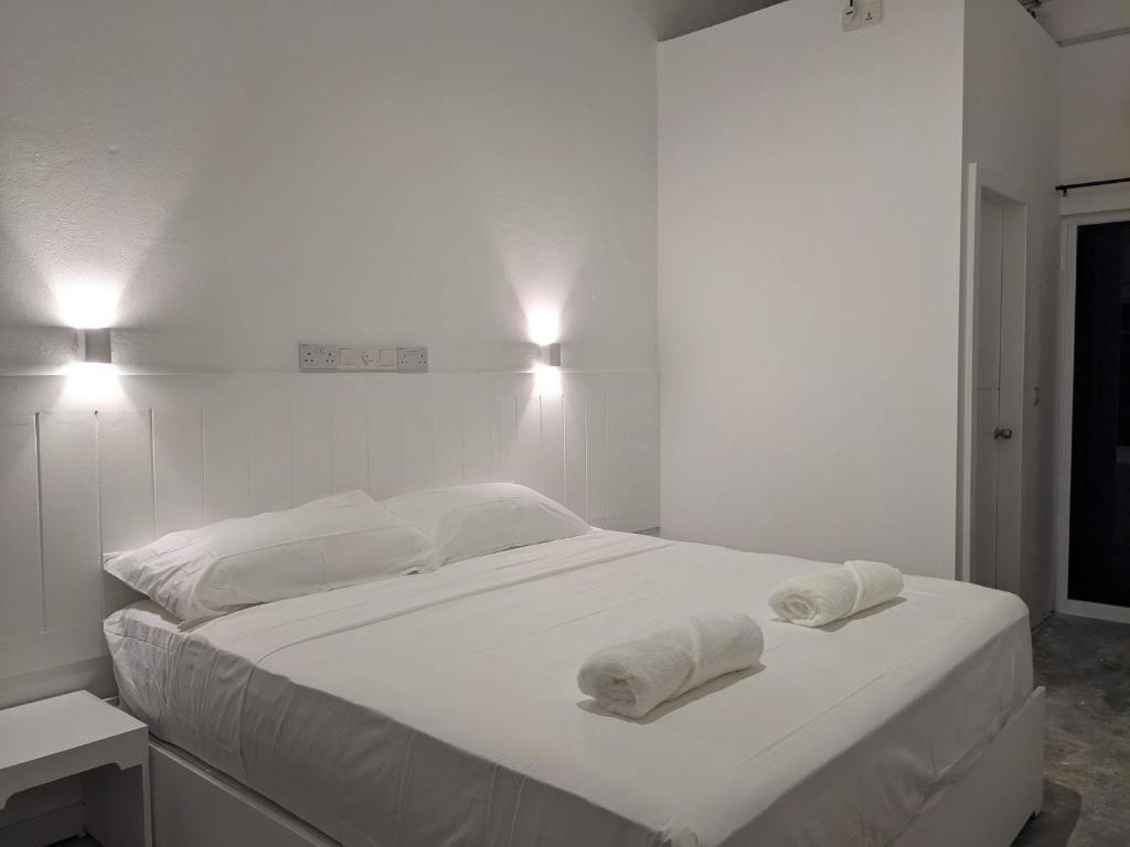 Postel nebo postele na pokoji v ubytování Avi Guesthouse