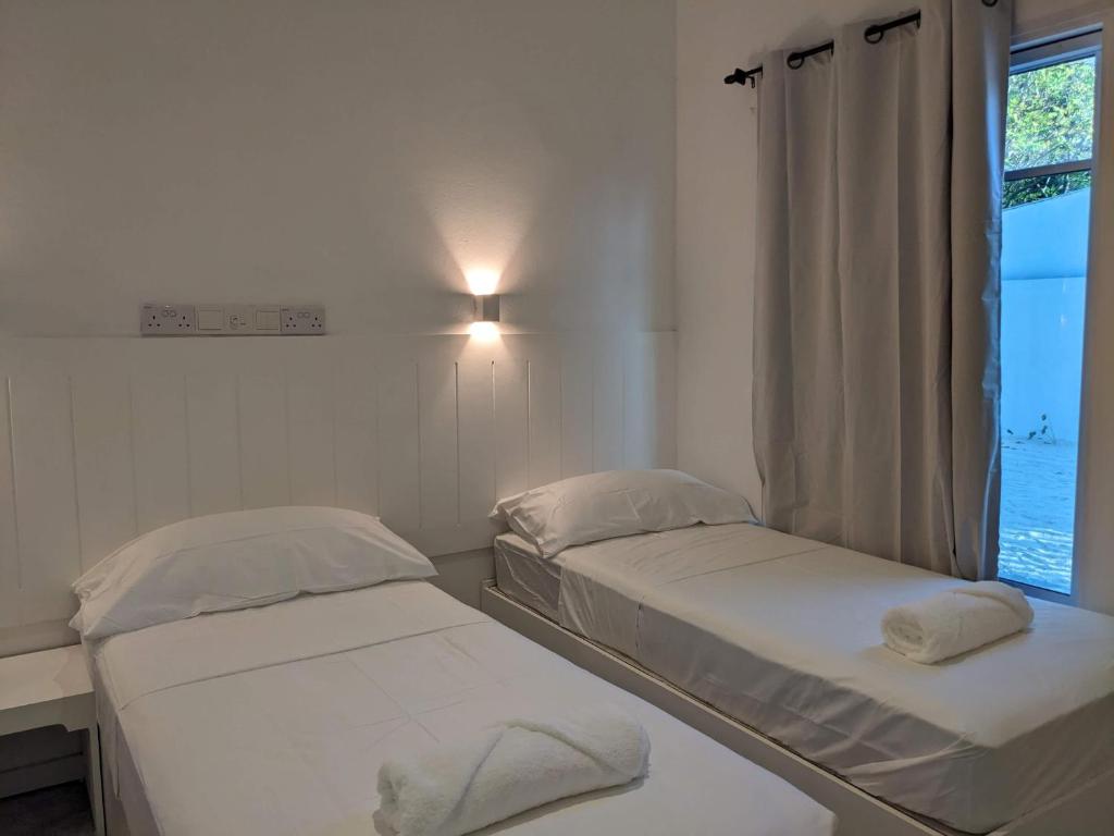 Postel nebo postele na pokoji v ubytování Avi Guesthouse