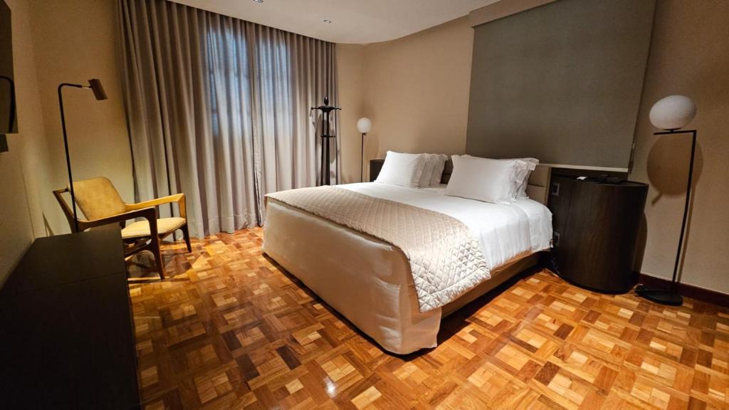 Postel nebo postele na pokoji v ubytování Hotel Glória Resort & Convention
