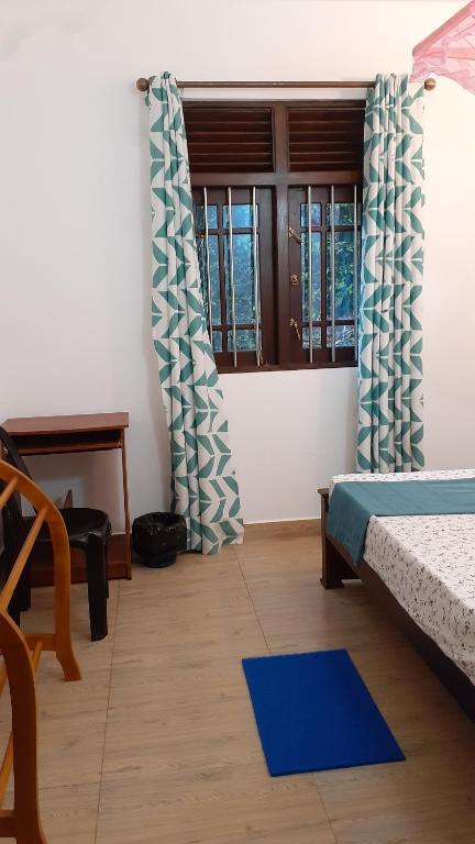 Postel nebo postele na pokoji v ubytování Jithu homestay Mirissa