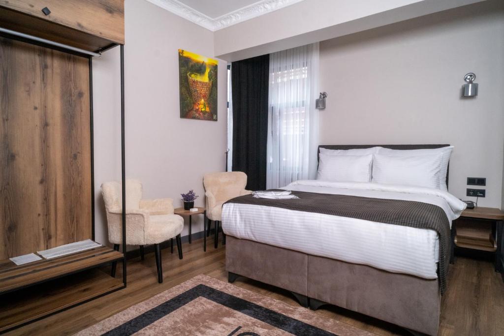 Postel nebo postele na pokoji v ubytování Grand CLOVER Hotel