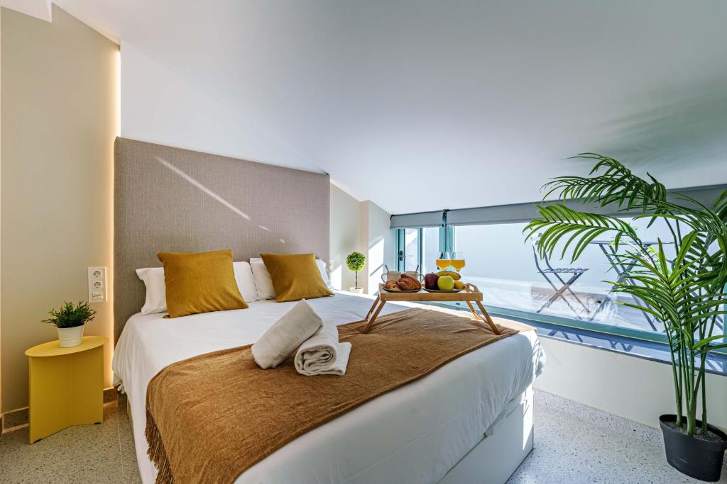 Łóżko lub łóżka w pokoju w obiekcie SUNSET MALAGA - PRIME & DESIGN