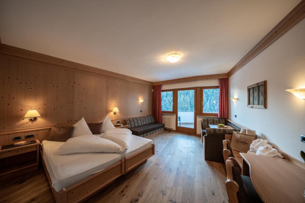 Postel nebo postele na pokoji v ubytování Hotel Christoph