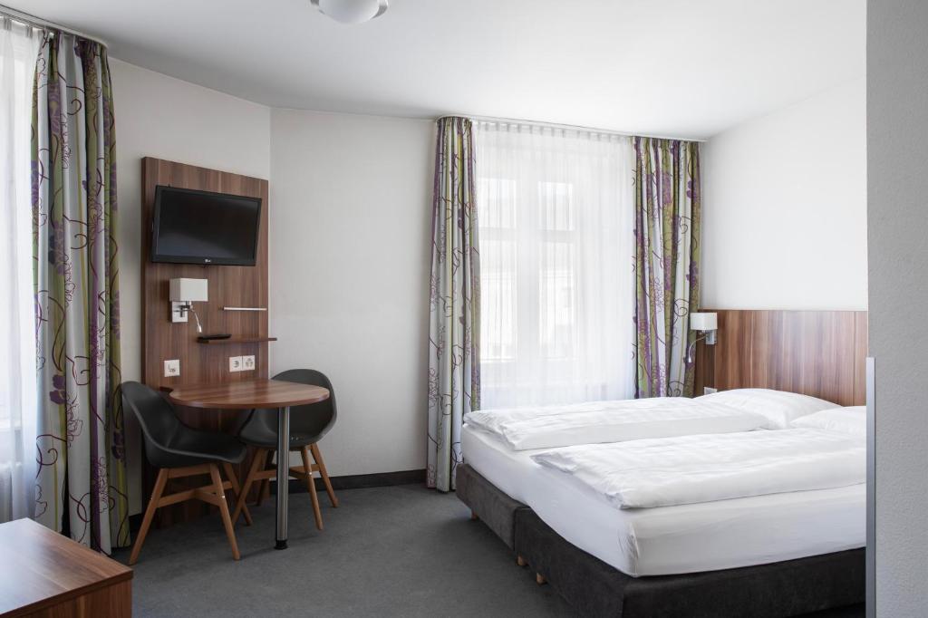 Postel nebo postele na pokoji v ubytování Hotel Resslirytti
