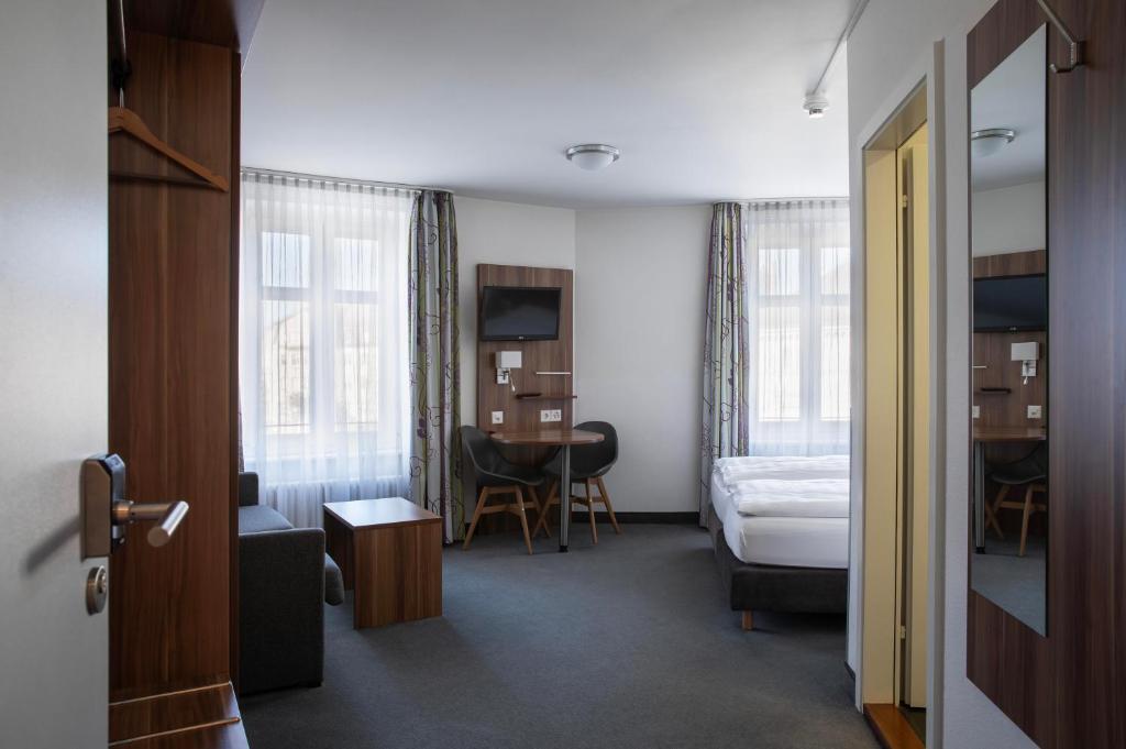 Postel nebo postele na pokoji v ubytování Hotel Resslirytti