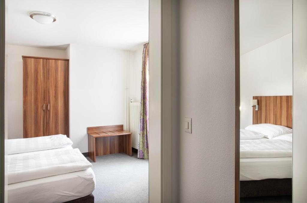 Postel nebo postele na pokoji v ubytování Hotel Resslirytti