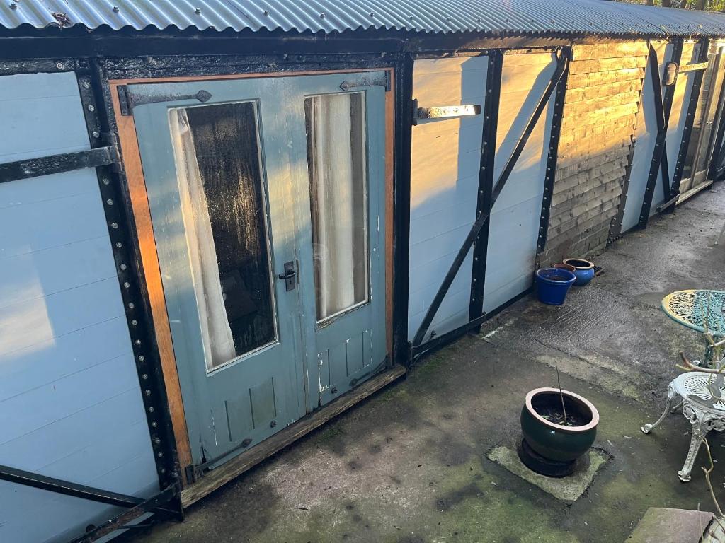 an outside view of a house with a door at The carriage in Three Cocks Junction