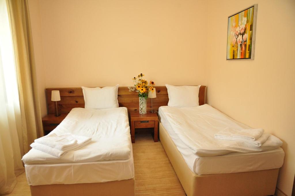 Postel nebo postele na pokoji v ubytování 3 Mountains Hotel