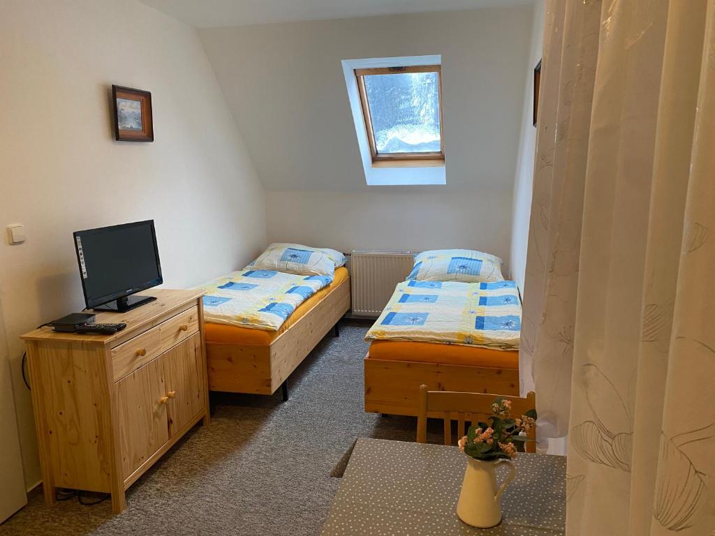 Postel nebo postele na pokoji v ubytování Penzion Lukeš