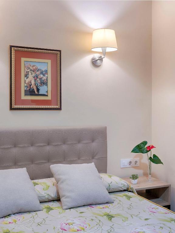 Postel nebo postele na pokoji v ubytování Hostal Antigua Morellana