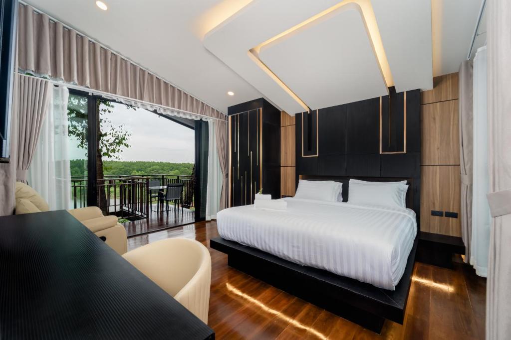 Postel nebo postele na pokoji v ubytování High Tree Resort, Krabi